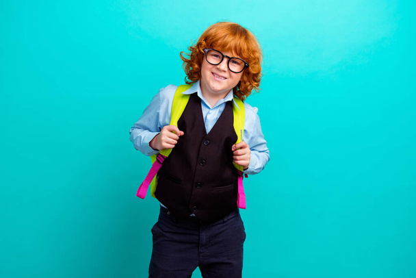 Photo of cheerful intelligent cute schoolchild toothy smile carry backpack isolated on emerald color background. - Photo, Image