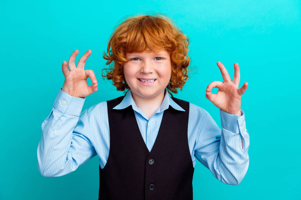 Photo portrait of charming curly redhead boy show double okey symbol wear trendy school garment isolated on aquamarine color background. - Φωτογραφία, εικόνα
