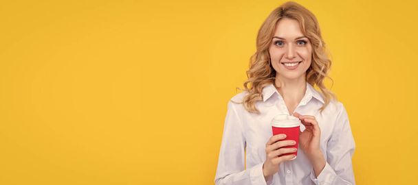Woman with coffee cup. smiling blond woman with coffee cup on yellow background. Woman isolated face portrait, banner with mock up copy space - Photo, Image