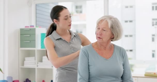 Woman, physiotherapy and helping senior patient with rehabilitation of body pain, arthritis and medical advice. Physiotherapist, healthcare assessment and chiropractor check spine for healing injury. - Materiał filmowy, wideo