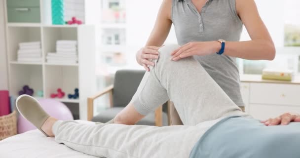 Physiotherapist, massage and medical training for patient with an injury for recovery as therapy rehabilitation. Joint, health and physiotherapy help person or client with knee motion and support. - Footage, Video