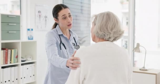 Woman, doctor and consulting senior patient in care, support or trust for checkup appointment at hospital. Happy female person or medical healthcare professional talking to elderly customer at clinic. - Filmmaterial, Video
