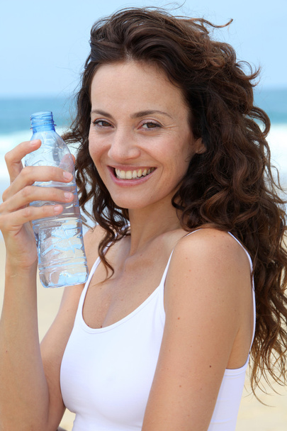 Beautiful woman drinking water - Fotografie, Obrázek