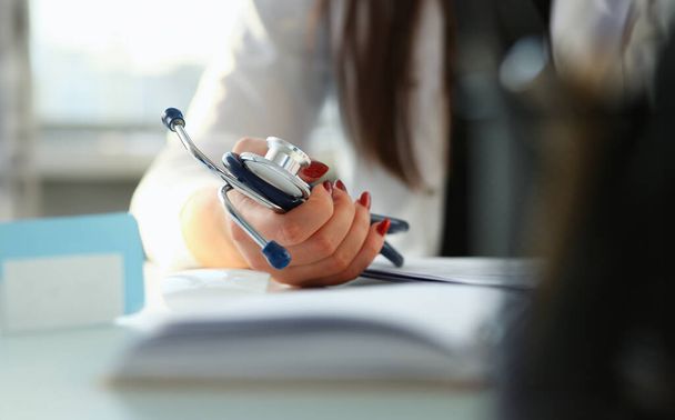 Female doctor hand hold phonendoscope in medical hospital resuscitation background - Photo, Image
