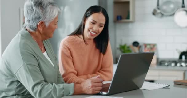 Home laptop, happy and senior mother, woman and smile for financial bills, pension fund increase or mortgage. Kitchen discussion, tax return and people check savings profit, retirement budget or loan. - Footage, Video