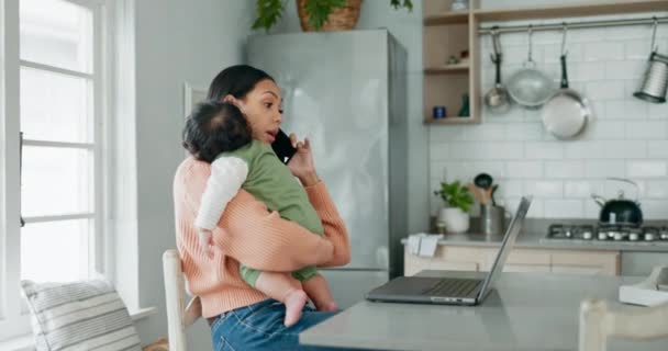 Phone call, remote work and a mother holding her baby in the living room of her home while working as a freelance entrepreneur. Laptop, startup and single parent with her infant child in the kitchen. - Video