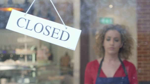 Woman flipping over closed sign - Footage, Video