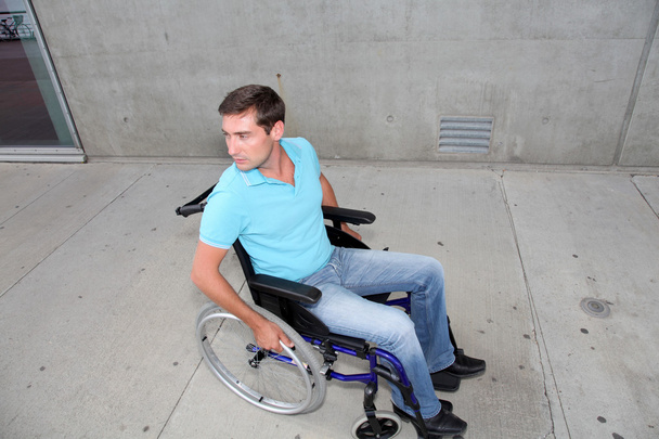 Young man using wheelchair - 写真・画像