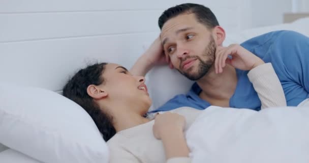 Couple, talking and home bed in morning for love, care or support in healthy relationship. Man listening to woman speak in bedroom with pajamas for security, comfort and communication with partner. - Footage, Video