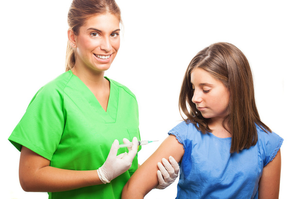 Nurse injecting to a girl - Photo, Image