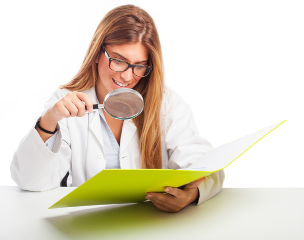 Doctor with a magnifying glass - Foto, Bild