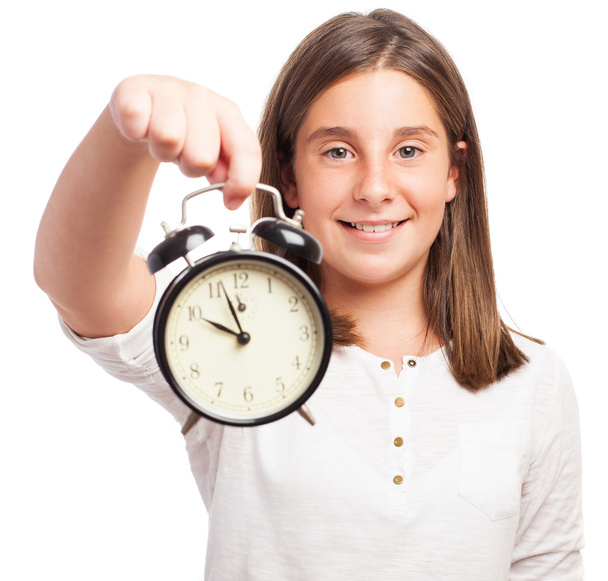 Girl holding an alarm clock - Φωτογραφία, εικόνα