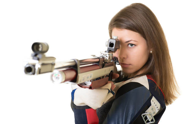 Woman training sport shooting with air rifle gun - Photo, Image