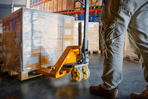 Workers Unloading Package Boxes on Pallets in Storage Warehouse.  Forklift Pallet Jack Loader. Supplies Shipment, Supply Chain Goods, Distribution Warehouse Shipping. - Photo, Image