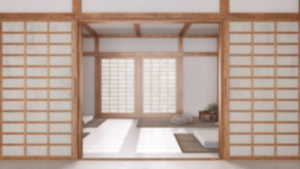 Sfondo sfocato, stanza di meditazione minima con porta di carta. Capet, cuscini e tatami. Travi in legno e carta da parati. Japandi interior design - Foto, immagini