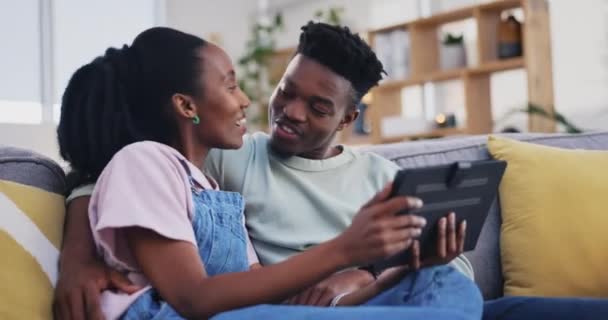 Tablet, relax or black couple online shopping on social media for ecommerce on internet connection at home. Love, hug or happy woman talking or speaking to African man or reading news blog together. - Footage, Video