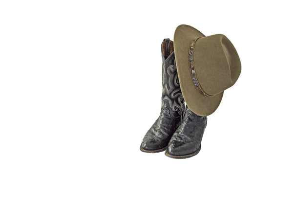 A pair of fancy black cowboy boots with a green felt outback hat - Photo, Image