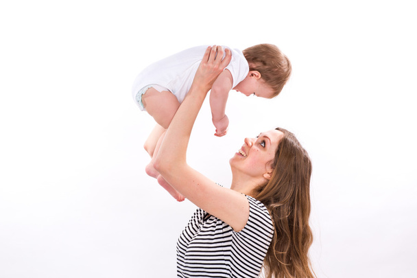 Beautiful baby and mother playing - 写真・画像