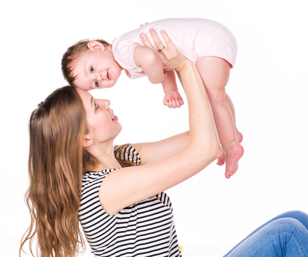 Beautiful baby and mother playing - 写真・画像