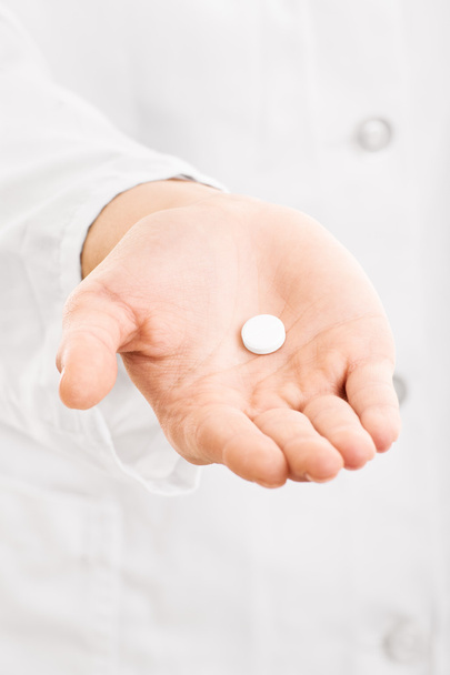 Doctor hand giving pill - Photo, Image