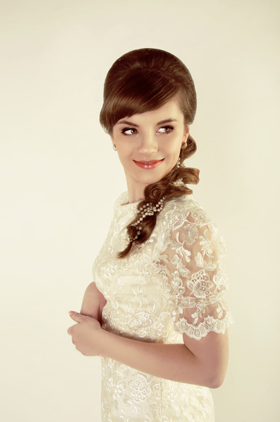 Beautiful young bride with retro hairstyle, back combing and pea - Photo, Image