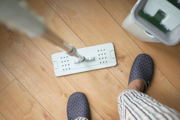 cleaning tiles floor with mop . - Photo, Image