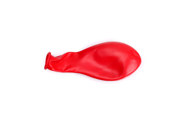 Balão vermelho não soprado isolado em branco - Foto, Imagem