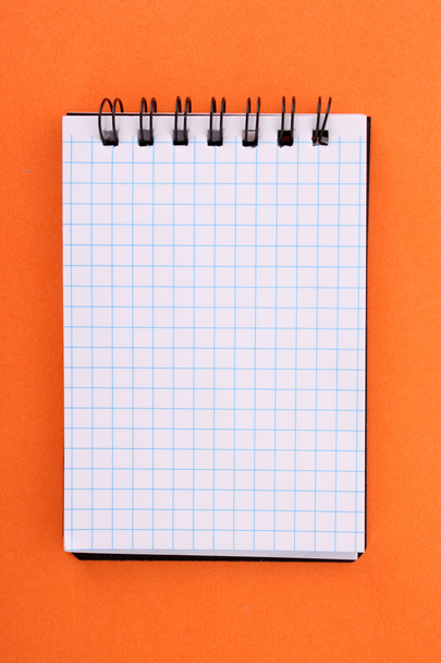 Notebook on the orange background - Valokuva, kuva