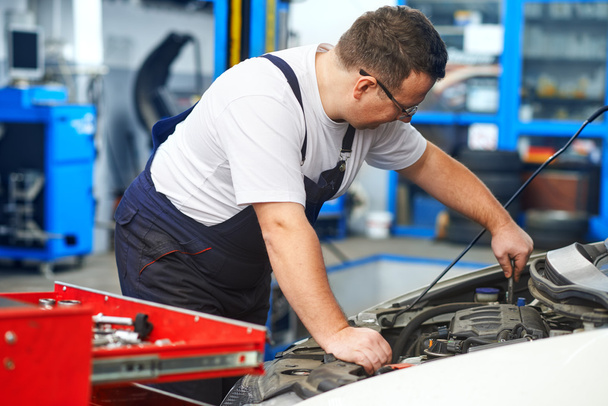 Mechanic in car service - Photo, image