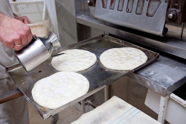 Making olive oil pancakes  - Фото, изображение