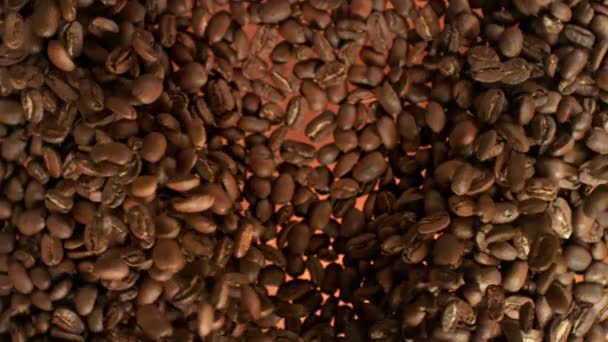 Super Slow Motion Shot of Flying Coffee Beans Towards at 1000fps. Съемки с высокой скоростью кинокамеры в 4k. - Кадры, видео