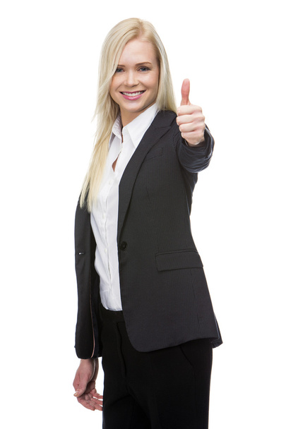 Χαμογελώντας ξανθιά επιχειρηματίας αντίχειρα επάνω με το ένα χέρι - Φωτογραφία, εικόνα
