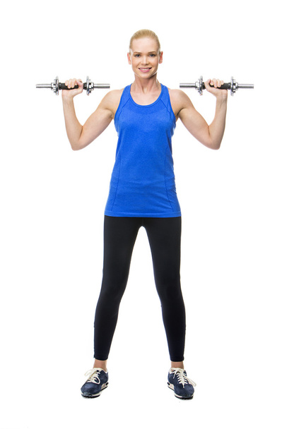 mulher loira vestindo roupas fitness exercitando com pesos
 - Foto, Imagem