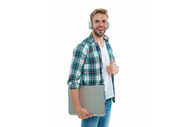 millennial man student smile on background. millennial man student in studio. photo of millennial man student with laptop. millennial man student isolated on white. - Valokuva, kuva