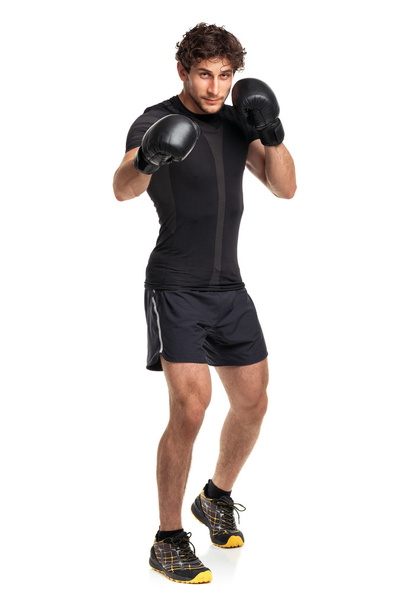 Athletic attractive man wearing boxing gloves on the white - Foto, Bild