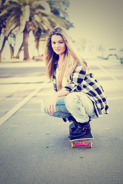 Beautiful female Skateboarder - Photo, Image