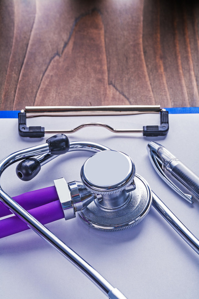 Stethoscope with purple tubes and ballpoint pen - Photo, Image