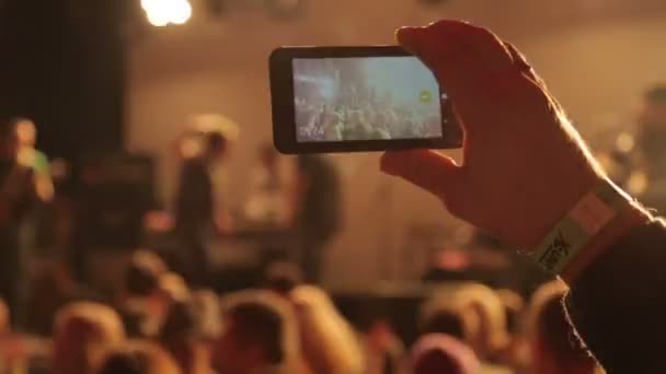 People taking video with touch smart phone during a music - Footage, Video