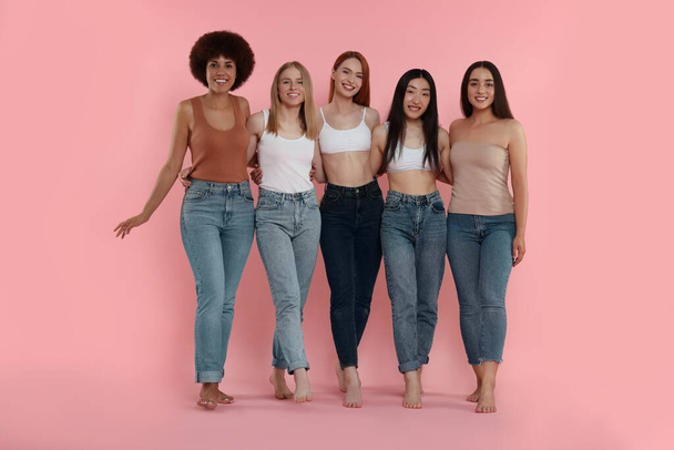 Group of beautiful young women on pink background - Φωτογραφία, εικόνα