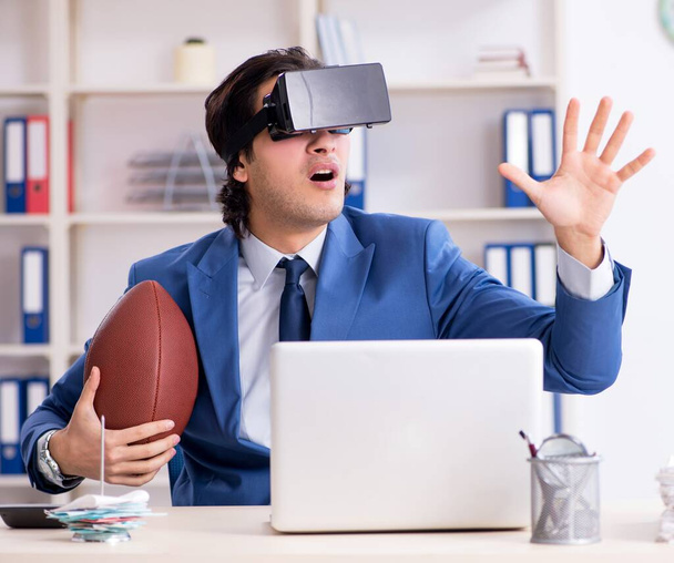 The young handsome businessman playing rugby with virtual glasses - Fotografie, Obrázek