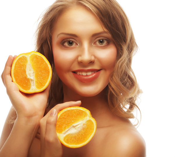 Beautiful close-up young woman with oranges - Φωτογραφία, εικόνα