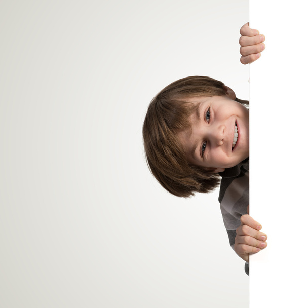 Chłopiec z banerów reklamowych - Zdjęcie, obraz