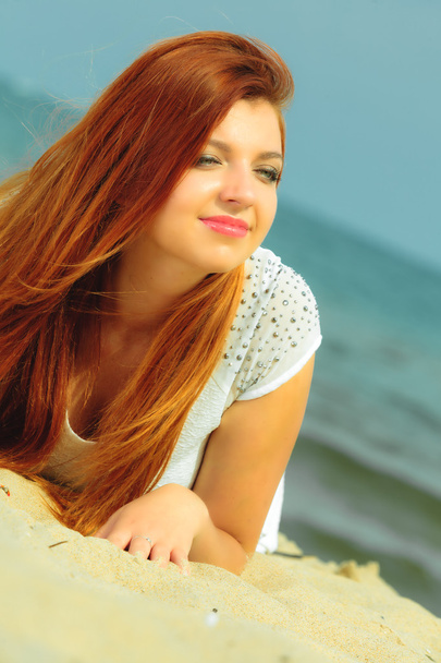 Beautiful redhaired girl lying - Photo, image