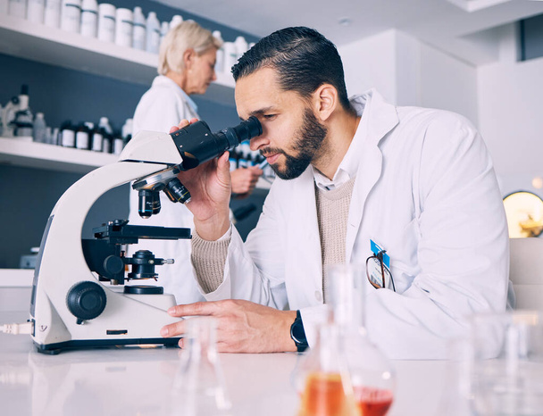 Science man, microscope analysis and laboratory for research, molecules or particles of bacteria at pharma job. Scientist team, medical vision and studying with virus for pharmaceutical innovation. - Photo, Image