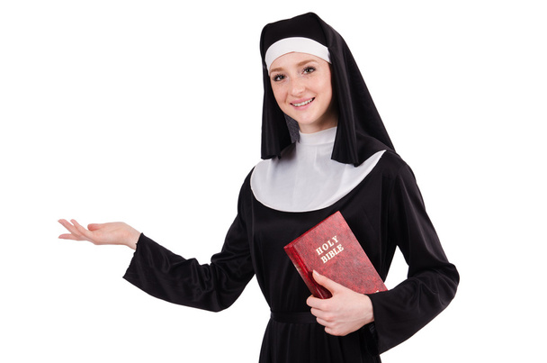 Jonge non met bijbel geïsoleerd op wit - Foto, afbeelding