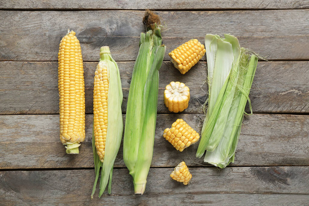Fresh corn cobs on grey wooden table - Photo, Image