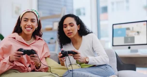 Lgbt women on sofa playing video games, competition and relax in living room of home with internet, controller and streaming. Online gaming, esports and happy lesbian couple on couch with virtual fun. - Footage, Video