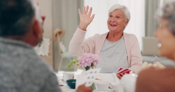 High five, poker and senior friends at a tea party together during a visit in a home for bonding. Smile, retirement and support with a group of elderly people in a living room for a social gathering. - Záběry, video