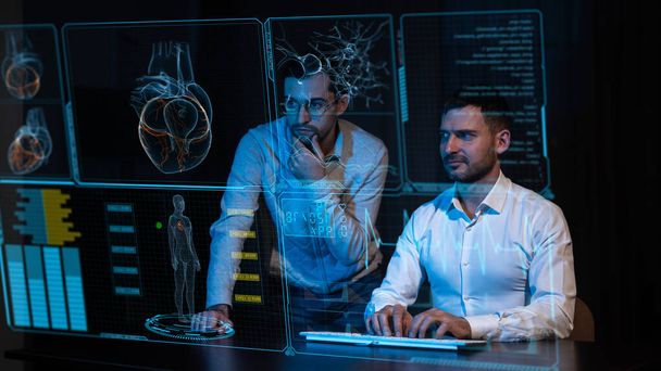Two caucasian bearded men are looking and discussing the data on the virtual menu medical screen. Readings on the life support monitor - Zdjęcie, obraz
