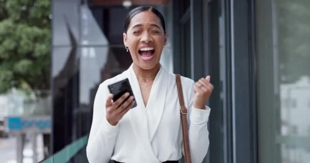 Business woman, phone and celebration in street, city and excited for prize, giveaway or profit on investment. Entrepreneur, trading and smartphone with fintech, gambling or lottery with app in cbd. - Footage, Video